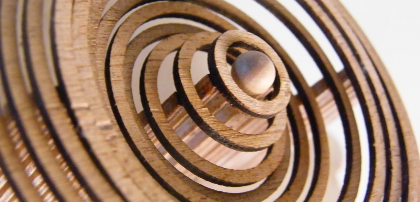 a water droplet wave recreated in wood.