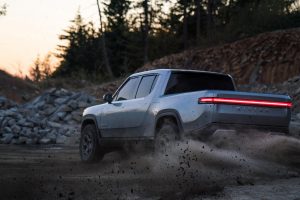 first amazon and now ford investing in all-electric pickup truck startup rivian.